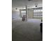 Spacious garage with two bays and overhead lighting providing lots of room for vehicles and storage at 507 Hillside Dr. N, North Myrtle Beach, SC 29582