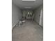 Garage interior with bright overhead lighting, storage on the left and two water heaters in the rear at 507 Hillside Dr. N, North Myrtle Beach, SC 29582