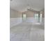 Bright living room featuring wainscoting detail, and large windows with a ceiling fan at 507 Hillside Dr. N, North Myrtle Beach, SC 29582