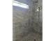 Modern shower with tiled walls, a shower head and sleek fixtures at 507 Hillside Dr. N, North Myrtle Beach, SC 29582