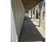 Exterior walkway with tall white support columns and a wooden ceiling, perfect for outdoor activities at 507 Hillside Dr. N, North Myrtle Beach, SC 29582