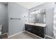 Stylish bathroom with a black vanity and modern fixtures at 5107 Capulet Circle, Myrtle Beach, SC 29588