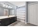 Modern bathroom featuring dark vanity and shower with modern shower curtain at 5107 Capulet Circle, Myrtle Beach, SC 29588