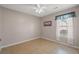 Bright bedroom with window, neutral walls and tiled floors at 5107 Capulet Circle, Myrtle Beach, SC 29588