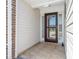 The entryway with tile flooring and storm door is inviting and secure at 5107 Capulet Circle, Myrtle Beach, SC 29588