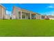 Expansive backyard with a covered patio, offering ample space for outdoor activities and entertainment at 5309 Abbey Park Loop, Myrtle Beach, SC 29579