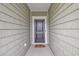 A welcoming front door with a welcome mat leading into the home at 5309 Abbey Park Loop, Myrtle Beach, SC 29579