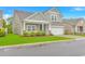 Charming two-story home with a well-manicured lawn and a two-car garage, plus inviting front porch at 5309 Abbey Park Loop, Myrtle Beach, SC 29579