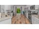 Bright kitchen with stainless steel appliances, granite countertops, and sliding glass doors to the outdoors at 5309 Abbey Park Loop, Myrtle Beach, SC 29579