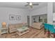 Open-concept living room and kitchen with a breakfast bar and hardwood floors at 5309 Abbey Park Loop, Myrtle Beach, SC 29579