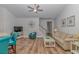 Bright living room featuring coastal decor, wood floors, and comfortable seating at 5309 Abbey Park Loop, Myrtle Beach, SC 29579