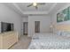 Relaxing main bedroom with a ceiling fan, and access to the ensuite bathroom and walk-in closet at 5309 Abbey Park Loop, Myrtle Beach, SC 29579