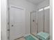 Clean white bathroom featuring a glass shower and a door at 5309 Abbey Park Loop, Myrtle Beach, SC 29579