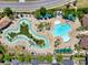 Overhead view of a community pool with lazy river and resort style seating areas at 5485 Elba Way # 5485, Myrtle Beach, SC 29579