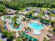 A fantastic aerial view of a community pool with lazy river and tropical landscaping at 5485 Elba Way # 5485, Myrtle Beach, SC 29579