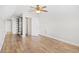 Bright bedroom features hardwood floors, ceiling fan, built in shelving and a door to the bathroom at 5485 Elba Way # 5485, Myrtle Beach, SC 29579