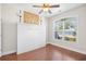 Bedroom featuring a murphy bed and large window with tranquil views of the lake at 5485 Elba Way # 5485, Myrtle Beach, SC 29579