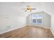 Bright bedroom features hardwood floors, ceiling fan, and a window with a water view at 5485 Elba Way # 5485, Myrtle Beach, SC 29579