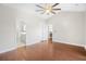 Spacious bedroom with wood floors, ceiling fan, and access to bathroom and kitchen at 5485 Elba Way # 5485, Myrtle Beach, SC 29579