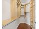 Walk-in closet with custom wooden shelving and hardwood floors for optimal storage at 5485 Elba Way # 5485, Myrtle Beach, SC 29579