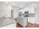 Well-lit kitchen featuring modern appliances, granite countertops, and custom cabinets at 5485 Elba Way # 5485, Myrtle Beach, SC 29579