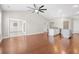 Expansive living room featuring hardwood floors, an open floor plan, and access to the kitchen at 5485 Elba Way # 5485, Myrtle Beach, SC 29579