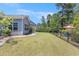 Expansive backyard with well-maintained lawn and fencing, ideal for Gathering activities at 5581 Plantersville Pl., Myrtle Beach, SC 29579