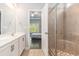 Bathroom with a dual sink vanity and walk-in shower with views of the bedroom at 5581 Plantersville Pl., Myrtle Beach, SC 29579