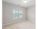 Bright bedroom with neutral carpet and a window at 5581 Plantersville Pl., Myrtle Beach, SC 29579
