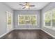 Bright dining area with ceiling fan, large windows, and door to the outdoor patio at 5581 Plantersville Pl., Myrtle Beach, SC 29579