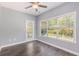 Bright dining area with ceiling fan, large windows, and door to the outdoor patio at 5581 Plantersville Pl., Myrtle Beach, SC 29579