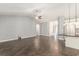 Bright living room connects to modern kitchen with stainless steel appliances and black countertop at 5581 Plantersville Pl., Myrtle Beach, SC 29579