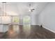 Open-concept living area featuring hardwood floors, modern lighting, and seamless flow to kitchen at 5581 Plantersville Pl., Myrtle Beach, SC 29579