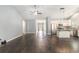 Bright open-concept living area with hardwood floors, and seamless flow to kitchen and hallway at 5581 Plantersville Pl., Myrtle Beach, SC 29579
