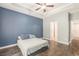 Main bedroom with hardwood floors, tray ceiling, fan, and neutral colored walls at 5581 Plantersville Pl., Myrtle Beach, SC 29579