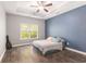 Main bedroom with a tray ceiling, fan, and hardwood floors at 5581 Plantersville Pl., Myrtle Beach, SC 29579