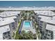 Aerial view of condo community with a pool and beach in the background at 5601 N Ocean Blvd. # C-106, Myrtle Beach, SC 29577