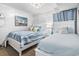 Charming bedroom featuring two beds with beach-themed decor, bright lighting, and comfortable space for relaxing by the shore at 5601 N Ocean Blvd. # C-106, Myrtle Beach, SC 29577