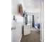 Hallway with a view of a bedroom, dresser and a plant providing functionality and style for a comfortable living space at 5601 N Ocean Blvd. # C-106, Myrtle Beach, SC 29577