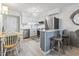 Open floor plan featuring kitchen with stainless steel appliances and a breakfast bar area, plus a dining space at 5601 N Ocean Blvd. # C-106, Myrtle Beach, SC 29577