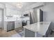 Bright kitchen features stainless steel appliances, white cabinets, and a stylish anchor rug, creating a welcoming space at 5601 N Ocean Blvd. # C-106, Myrtle Beach, SC 29577