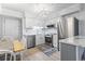 Bright kitchen featuring stainless steel appliances, white cabinets, and stylish lighting, creating a functional and inviting space at 5601 N Ocean Blvd. # C-106, Myrtle Beach, SC 29577