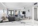 Bright and airy living room with comfortable seating, a flat-screen TV, and access to the balcony at 5601 N Ocean Blvd. # C-106, Myrtle Beach, SC 29577