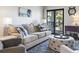Comfortable living room with a cozy couch, stylish pillows, and a unique nautical themed ottoman at 5601 N Ocean Blvd. # C-106, Myrtle Beach, SC 29577