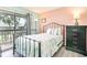 Comfortable bedroom featuring a balcony view, soft colors, and an eye-catching metal frame bed at 5905 S Kings Highway # 6302, Myrtle Beach, SC 29575