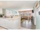 Open-concept kitchen view with bar seating that looks into the living room area at 5905 S Kings Highway # 6302, Myrtle Beach, SC 29575