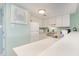 Well-lit kitchen with white appliances, ample counter space, and modern fixtures at 5905 S Kings Highway # 6302, Myrtle Beach, SC 29575