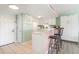 Bright kitchen featuring white cabinets, breakfast bar with seating, and ample counter space at 5905 S Kings Highway # 6302, Myrtle Beach, SC 29575
