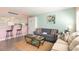 Inviting living room showing comfortable seating, kitchen bar with stools, and stylish decor at 5905 S Kings Highway # 6302, Myrtle Beach, SC 29575