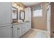 A bathroom featuring double sinks, granite countertops, and a tiled shower at 6001-T36 South Kings Hwy., Myrtle Beach, SC 29575